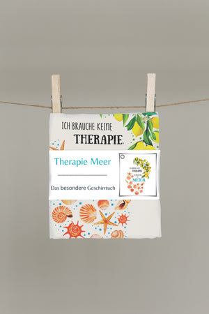 Gefaltetes Therapie Meer Geschirrtuch mit hochwertiger Banderole und maritimem Sommermotiv